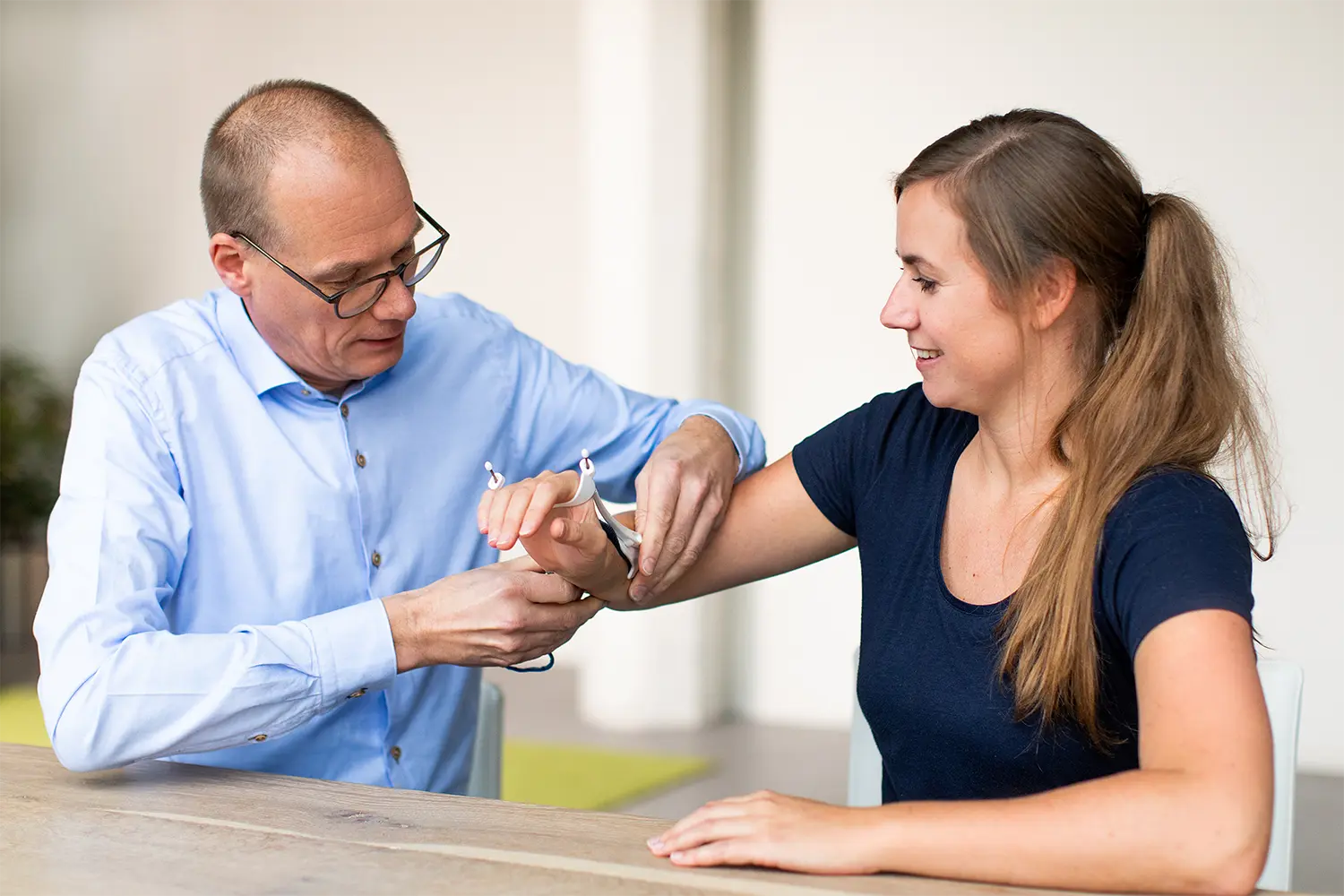 Medical device consulting engineer demonstrating arm brace